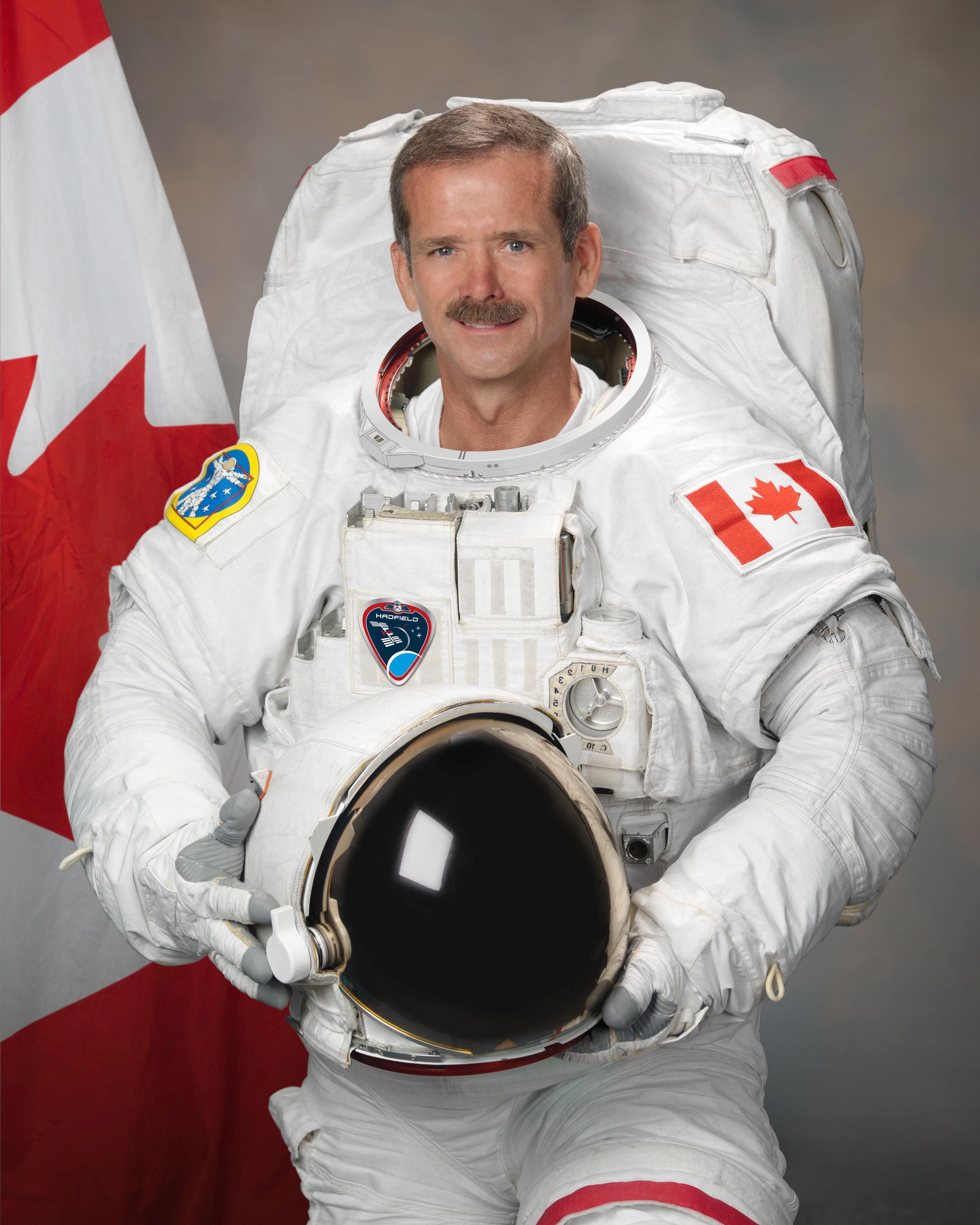 Photograph official portrait of Canadian Astronaut Chris Hadfield in EMU suit. Photo Date: July 19, 2011. Location: Building 8, Room 183 - Photo Studio. Photographer: Robert Markowitz
