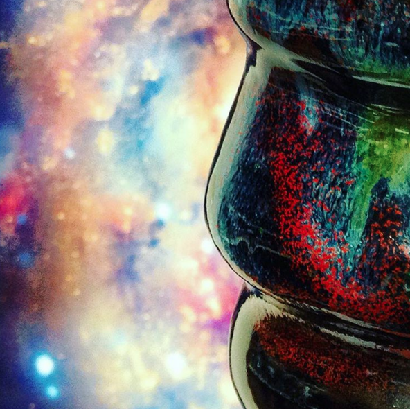 Cosmic Mug glaze detail next to a spiral galaxy collision.